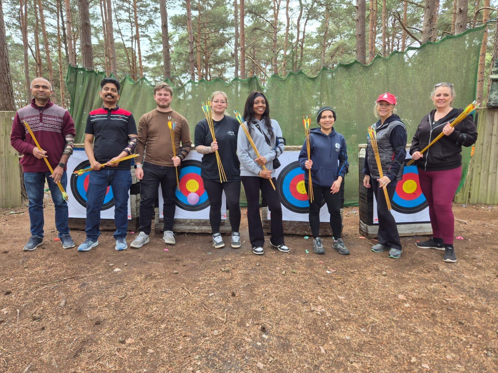 A group taking part in an archery session as part of a multi-activity combo package