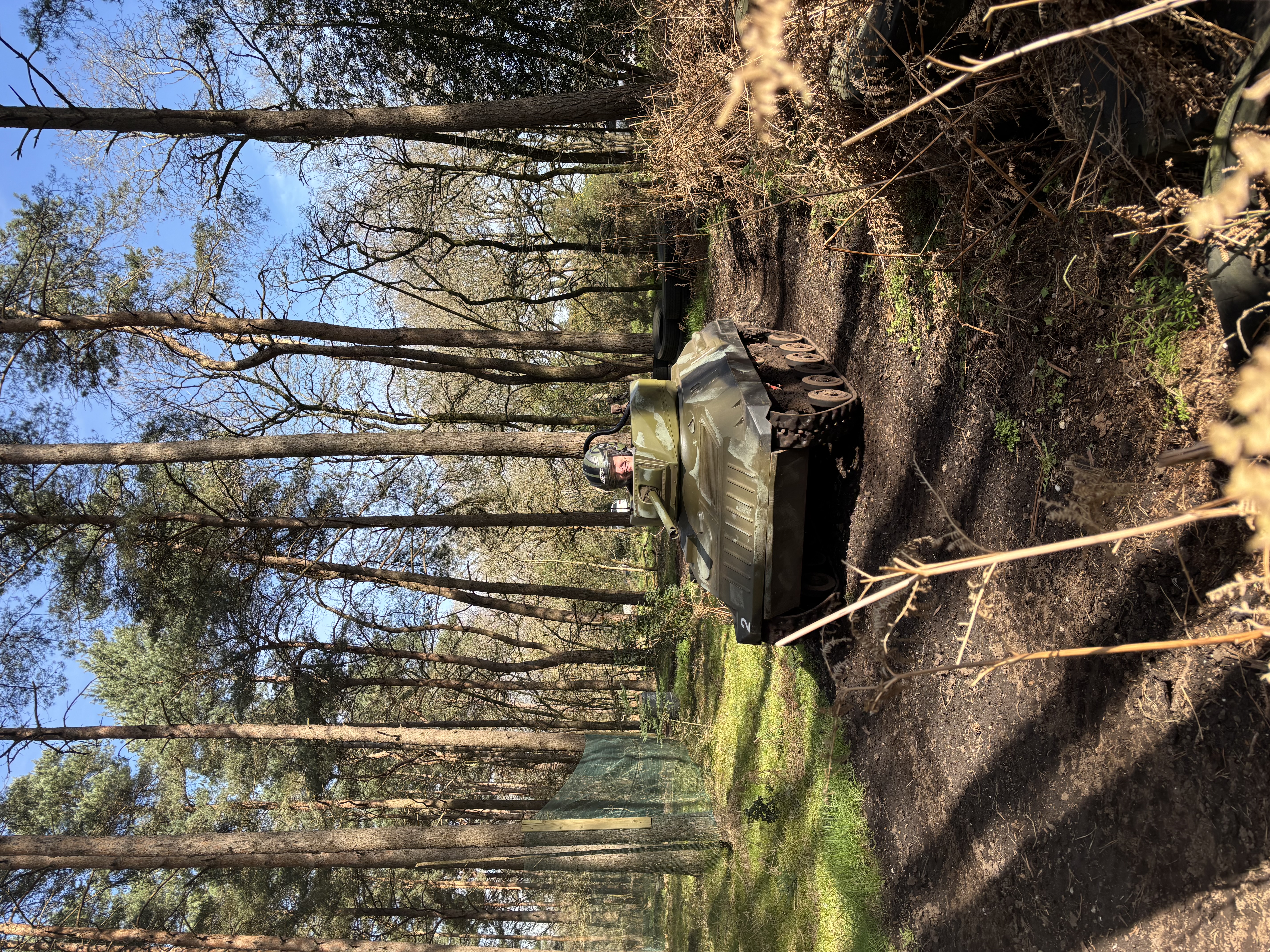 Mini tank driving on the woodland course